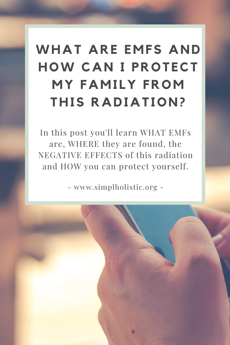 photo of a hand holding a phone saying "how can I protect my family from EMFs and what are EMFs"